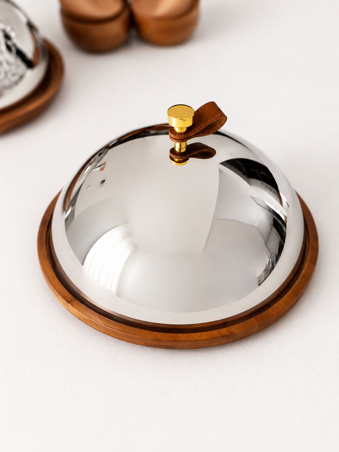 wooden plate with its stainless cover